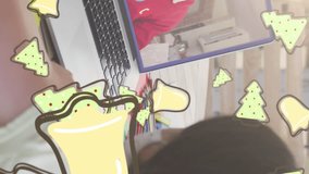 Animation of christmas cookies over caucasian girl with face mask on laptop video call with family. christmas, tradition and celebration concept digitally generated video. - Powered by Shutterstock - Get 15% off with code: PIKWIZARD15