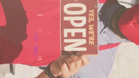 Animation of digital interface over man in face mask holding open sign. global networks, business and connections during covid 19 pandemic concept digitally generated video. - Powered by Shutterstock - Get 15% off with code: PIKWIZARD15