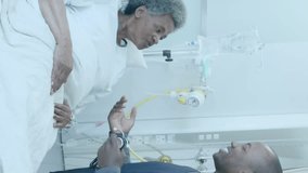 Animation of element diagram over happy african american male doctor and senior female patient. Consultation, data, digital interface, connection, hospital and healthcare, digitally generated video. - Powered by Shutterstock - Get 15% off with code: PIKWIZARD15