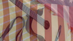 Animation of american flag and light spots over guitar, smartphone and bag on beach towels in sun. America, summer, vacations, lifestyle, communication and patriotism, digitally generated video. - Powered by Shutterstock - Get 15% off with code: PIKWIZARD15