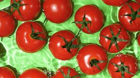Juicy Tomatoes Making Splash in Water. Macro Top View. - Powered by Shutterstock - Get 15% off with code: PIKWIZARD15