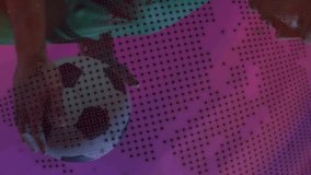 Animation of processing data and globe over caucasian male footballer playing with ball on purple. Network, sport, competition, digital interface and global communication, digitally generated video. - Powered by Shutterstock - Get 15% off with code: PIKWIZARD15