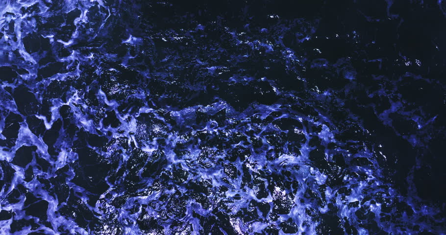 Aerial view of the dark ocean background Ripples and waves on deep water surface High definition sea background