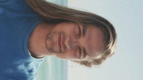 Smiling person at beach with social media notifications animation appearing. vacation, technology, happiness, vacation, ocean, summer - Powered by Shutterstock - Get 15% off with code: PIKWIZARD15