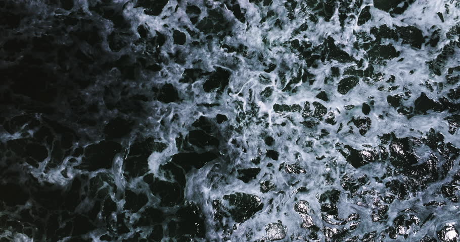 Aerial view of the dark ocean background Ripples and waves on deep water surface High definition sea background