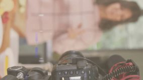 Animation of glowing light over camera with female vlogger recording culinary vlog at home. global social media, connection and communication concept digitally generated video. - Powered by Shutterstock - Get 15% off with code: PIKWIZARD15