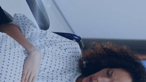 Animation of light spots over pregnant woman with nurse and husband in hospital. maternal mental health awareness week concept digitally generated video. - Powered by Shutterstock - Get 15% off with code: PIKWIZARD15