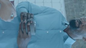 Animation of media icons over diverse business people talking in office. Global business and digital interface concept digitally generated video. - Powered by Shutterstock - Get 15% off with code: PIKWIZARD15