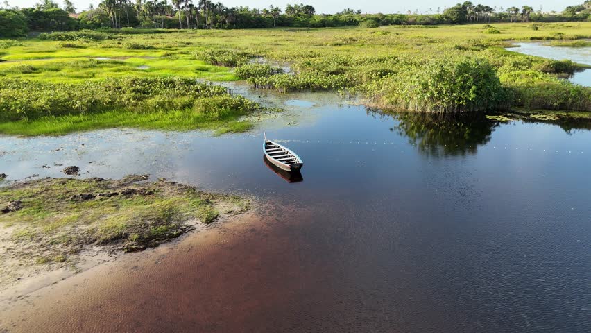 Isolated Canoe In Santo Amaro Maranhao Brazil. Tourists Enjoying Boat Trip Over Tropical Water Scenery. Holiday Landscape Peaceful Beauty. Holiday Coast. Santo Amaro Maranhao.
