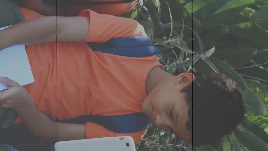 Animation of colourful puzzle pieces over school children using tablets. autism, learning difficulties, support and awareness concept digitally generated video. - Powered by Shutterstock - Get 15% off with code: PIKWIZARD15