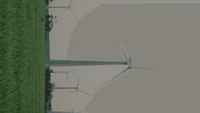 Animation of statistical data processing over spinning windmills on grassland against grey sky. Business data and renewable energy technology concept - Powered by Shutterstock - Get 15% off with code: PIKWIZARD15