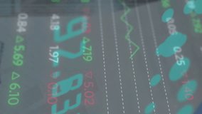 Animation of stock market data processing over world map against tall buildings. Global economy and business technology concept - Powered by Shutterstock - Get 15% off with code: PIKWIZARD15