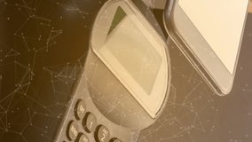 Animation of bitcoins over smartphone and payment terminal. global data security, finance and contactless payments safety concept digitally generated video. - Powered by Shutterstock - Get 15% off with code: PIKWIZARD15