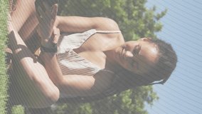 Animation of stock market data processing over woman using smartwatch sitting in the garden. Global economy and business data technology concept - Powered by Shutterstock - Get 15% off with code: PIKWIZARD15