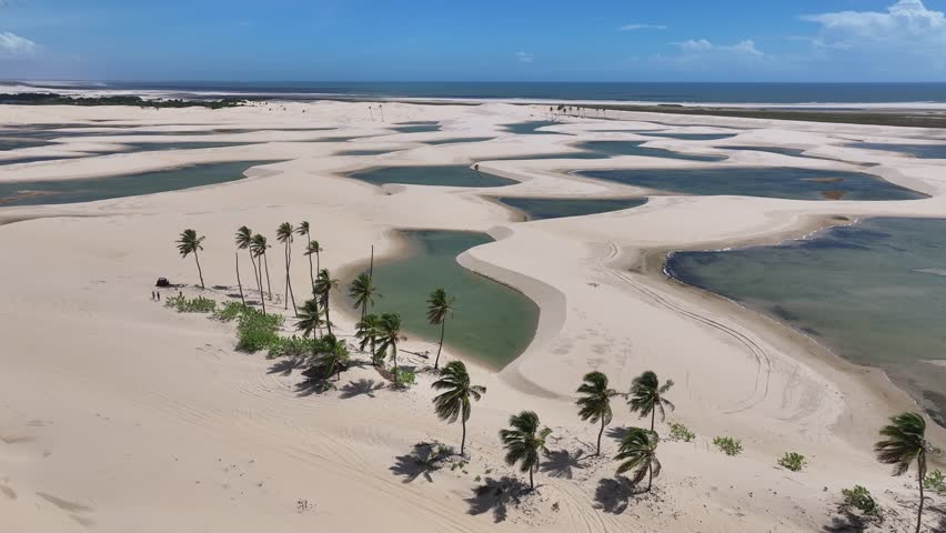 Small Sheets In Tutoia Maranhao Brazil. Natural Freshwater Lagoon Nestled Between White Sand Dunes. Shore Sky Beach Sea. Outdoors Beach Panorama. Tutoia Maranhao.
