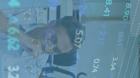 Animation of stock market data processing against diverse man and woman discussing at office. Global economy and business data technology concept - Powered by Shutterstock - Get 15% off with code: PIKWIZARD15