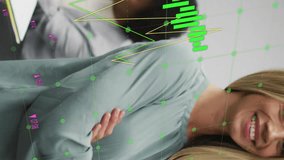 Animation of financial data processing over diverse businesspeople in office. Global finance, business, connections, computing and data processing concept digitally generated video. - Powered by Shutterstock - Get 15% off with code: PIKWIZARD15