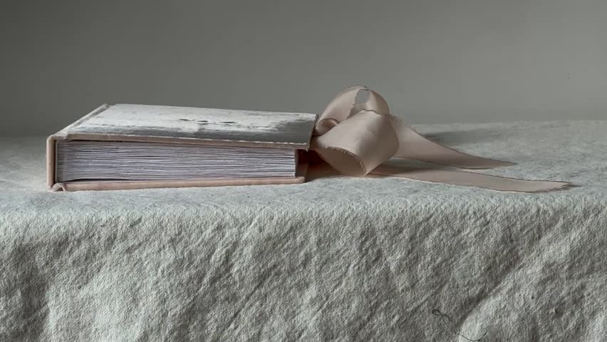 Luxury velvet photo album with silk ribbon. Handcrafted from 100% silk velvet, with pockets for photos. Perfect as a wedding album, guest book, or family keepsake.