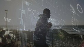 world map and charts fading, boxer shadow boxing along railing with fitness overlay tracking motion. Athlete, silhouette, digital graphics, fitness, training, outdoor, technological - Powered by Shutterstock - Get 15% off with code: PIKWIZARD15
