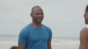Loving African American Couple Embracing Affectionately on the Beach, Romantic Black Man and Woman Hugging Tenderly by the Seaside During a Peaceful Tropical Vacation - Powered by Shutterstock - Get 15% off with code: PIKWIZARD15