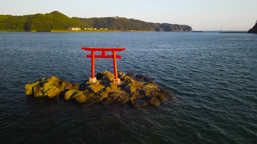 The Shinto gate of Torii. The picturesque bay of the city of Shimoda. Japan.