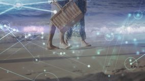 Senior couple walking barefoot along sand holding basket for picnic, network graphics drifting. Senior, companionship, leisure, relaxation, seaside, tranquility, digital overlay - Powered by Shutterstock - Get 15% off with code: PIKWIZARD15