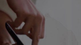 Animation of light bulbs over woman using tablet in background. global networking, ideas and business concept digitally generated video. - Powered by Shutterstock - Get 15% off with code: PIKWIZARD15