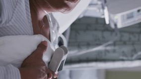 Animation of 3D coronavirus Covid 19 cell spinning over sick woman lying in hospital bed in the background. Global coronavirus pandemic concept digitally generated image. - Powered by Shutterstock - Get 15% off with code: PIKWIZARD15