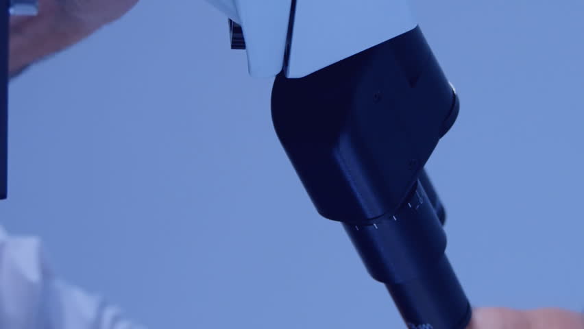 Animation of data processing over caucasian male scientist using microscope. Global science, digital interface, computing and data processing concept digitally generated video. - Powered by Shutterstock - Get 15% off with code: PIKWIZARD15