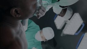Animation of dna strand over diverse surgeons in hospital. Global medicine, healthcare, connections, computing and data processing concept digitally generated video. - Powered by Shutterstock - Get 15% off with code: PIKWIZARD15