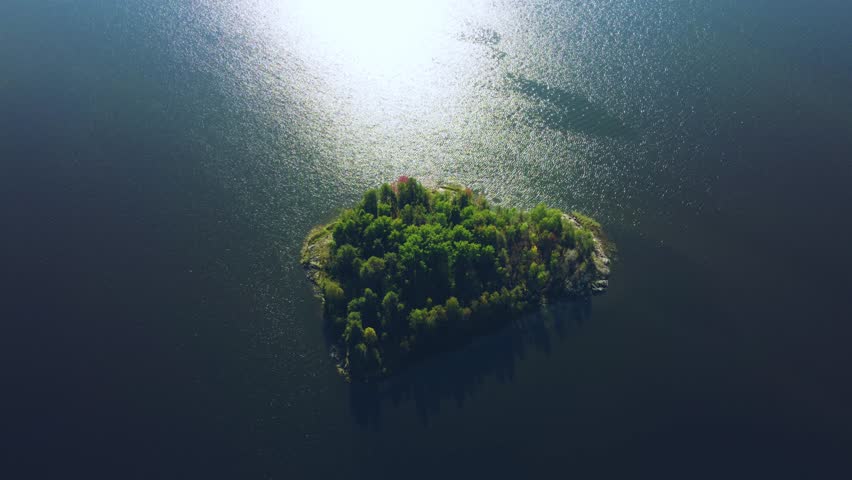 Russia, Lake Ladoga, Koyonsaari. View of the coast of the island in a cold lake. Beautiful nature of the Republic of Karelia. Panoramic view from the height of the Ladoga skerry islands. 4K