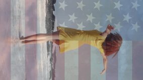 Animation of american flag and clouds over african american woman dancing on sunny beach. American independence day, 4th july, summer, vacations and celebration, digitally generated animation. - Powered by Shutterstock - Get 15% off with code: PIKWIZARD15