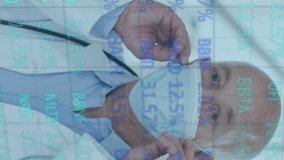 Animation of trading board over senior caucasian doctor wearing safety mask in hospital. Digital composite, multiple exposure, stock market, investment, protection, covid, medical and healthcare. - Powered by Shutterstock - Get 15% off with code: PIKWIZARD15