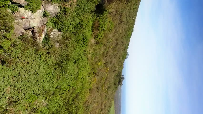 Video of rainbow fog over moving countryside landscape. find a rainbow day digitally generated video.