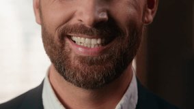 Close up half face portrait male white healthy teeth toothy smiling happy unrecognizable Caucasian adult businessman male indoors business man bearded guy in officesmile positive medicine dental care - Powered by Shutterstock - Get 15% off with code: PIKWIZARD15