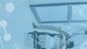 Animation of medical data processing over male doctor with girl patient. Global healthcare, science, medicine, research, computing and data processing concept digitally generated video. - Powered by Shutterstock - Get 15% off with code: PIKWIZARD15