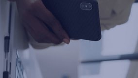 Animation of social media data processing over african american businesswoman with smartphone. Global social media, business, finances, computing and data processing concept digitally generated video. - Powered by Shutterstock - Get 15% off with code: PIKWIZARD15