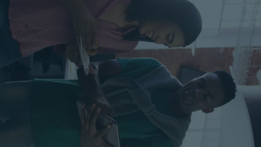 Animation of statistical data processing against diverse man and woman discussing at office. Computer interface and business data technology concept - Powered by Shutterstock - Get 15% off with code: PIKWIZARD15