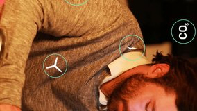 Animation of eco icons processing over caucasian businessman using laptop. Global computing, digital interface and data processing concept digitally generated video. - Powered by Shutterstock - Get 15% off with code: PIKWIZARD15