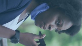 Animation of social media icons with growing numbers over african american woman using smartphone. Global social media, technology and digital interface concept digitally generated video. - Powered by Shutterstock - Get 15% off with code: PIKWIZARD15