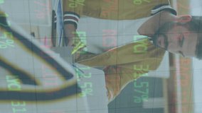 Animation of stock market data processing on two diverse men smiling looking at each other at office. Global economy and business technology concept - Powered by Shutterstock - Get 15% off with code: PIKWIZARD15