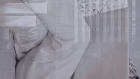 Animation of financial data processing over caucasian man using laptop. Global computing, digital interface and data processing concept digitally generated video. - Powered by Shutterstock - Get 15% off with code: PIKWIZARD15