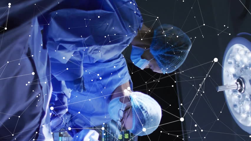 Animation of data processing and diagrams over diverse surgeons in operating room. Technology, medicine and digital interface concept digitally generated video. - Powered by Shutterstock - Get 15% off with code: PIKWIZARD15