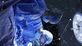 Animation of data processing and diagrams over diverse surgeons in operating room. Technology, medicine and digital interface concept digitally generated video. - Powered by Shutterstock - Get 15% off with code: PIKWIZARD15