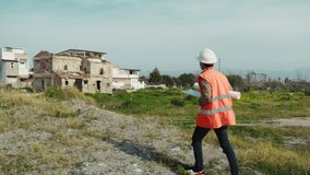 Engineer Walking On An High Spot To Watch The Construction Site From Above  - Powered by Shutterstock - Get 15% off with code: PIKWIZARD15