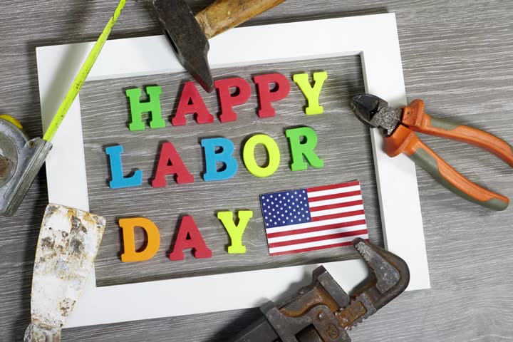 Happy Labor Day Message Decorated With Tools and American Flag on Wood
