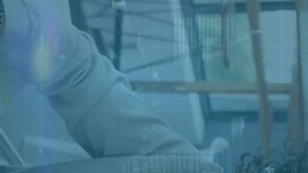 Animation of network of connections with icons over data processing and man using laptop. Technology and digital interface concept digitally generated video. - Powered by Shutterstock - Get 15% off with code: PIKWIZARD15