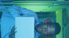 Animation of financial data processing over african american businessman working in server room. Global business, finances, communication and digital interface concept digitally generated video. - Powered by Shutterstock - Get 15% off with code: PIKWIZARD15