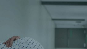 Pregnant woman in hospital gown with financial data animation over medical staff. Pregnancy, healthcare, maternity, finance, technology - Powered by Shutterstock - Get 15% off with code: PIKWIZARD15