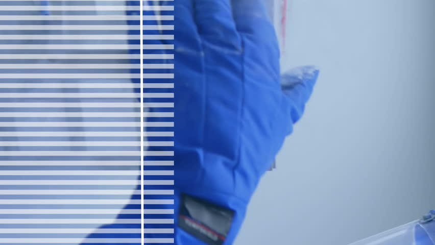 Handling equipment with data graph overlay, scientist in protective gear working. Laboratory, research, experiment, science, technology, analysis - Powered by Shutterstock - Get 15% off with code: PIKWIZARD15